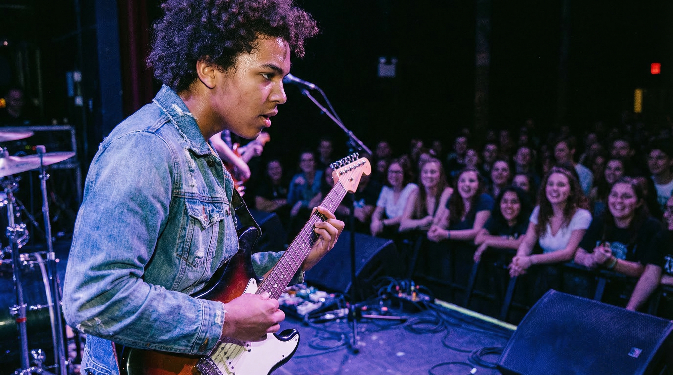 Teenager with acne confidently participating in a class presentation, representing not letting acne hold you back